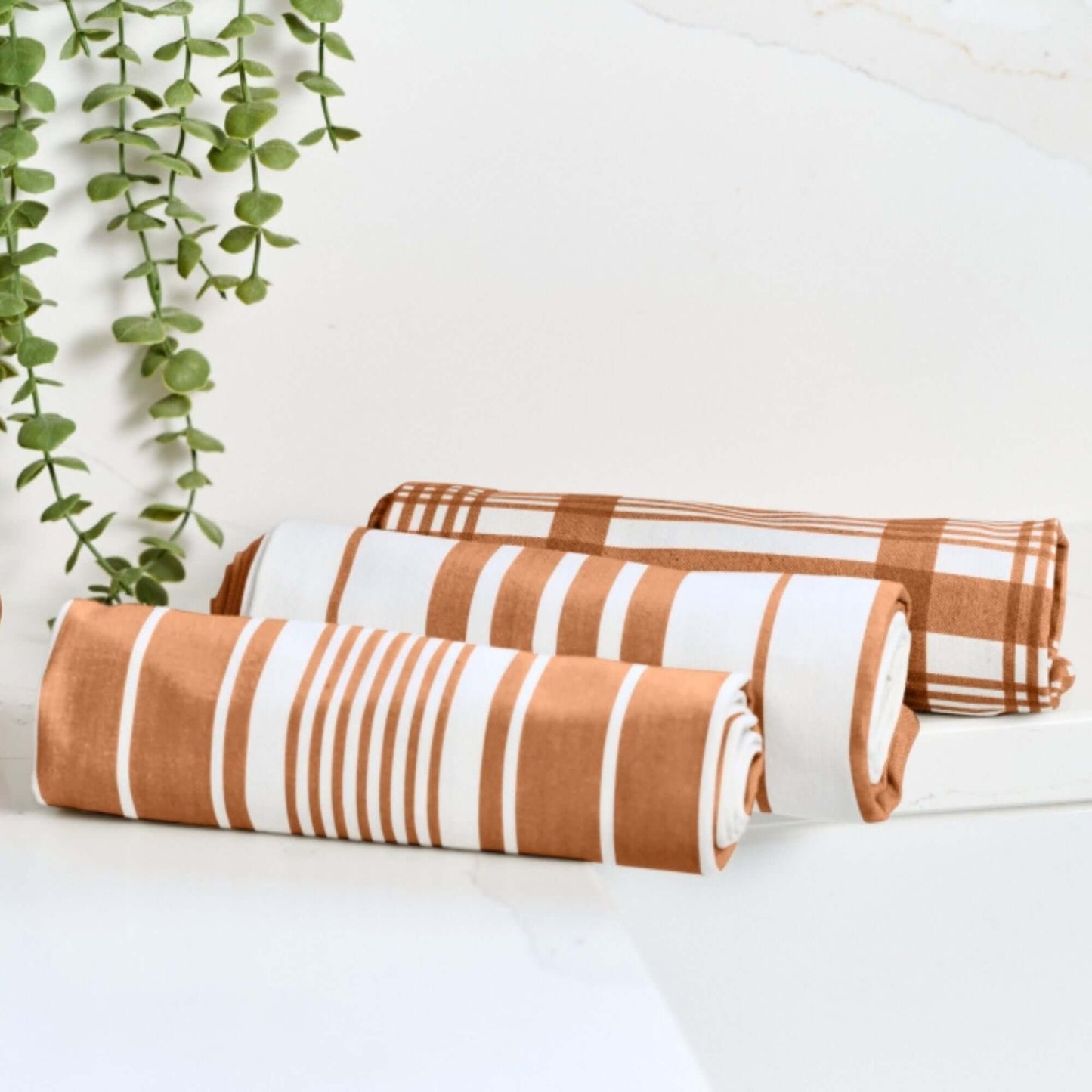 Tea Towel - Dexam - Set of 3 Extra Large - Love Colour - Terracotta displayed with striped and check designs.