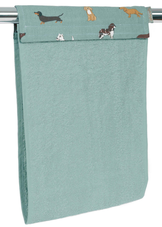 Sophie Allport "Fetch" Roller Hand Towel in sage blue with dog patterns hanging over an oven rail.