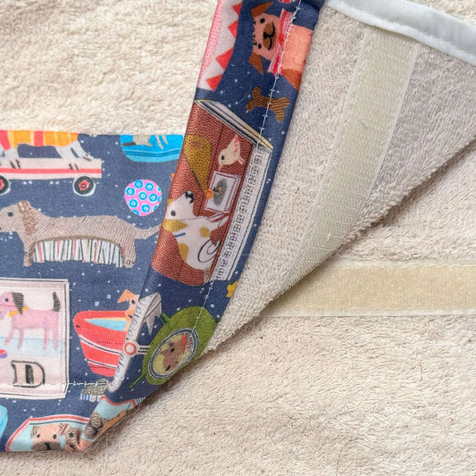 Sarah Battle "D is for Dog" Roller Hand Towel showcasing vibrant dog-themed fabric and soft cream towel.