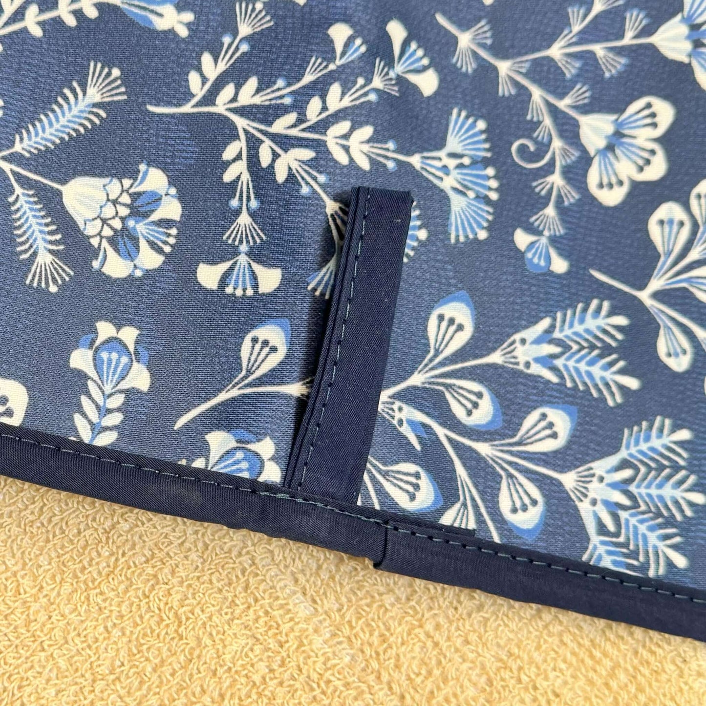 Asta Barrington Navy Folk Flower Double Oven Glove featuring a textured dark blue fabric with white and blue folk flower design.