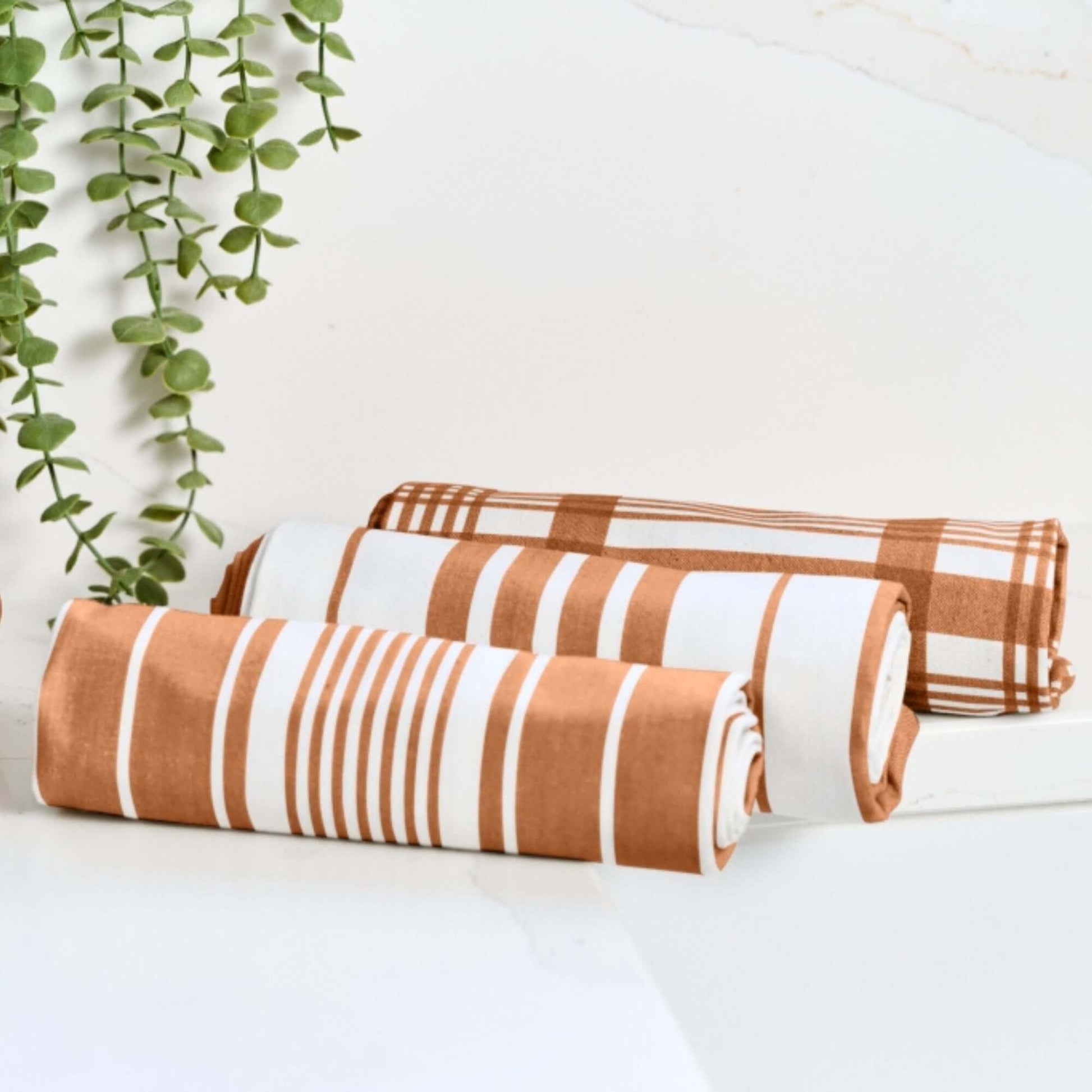 Tea Towel - Dexam - Set of 3 Extra Large - Love Colour - Terracotta displayed with striped and check designs.