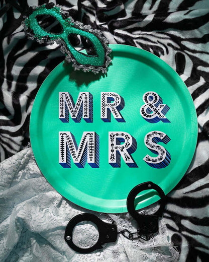 Serving Tray - Asta Barrington "MR & MRS" Green Round Tray (31cm) on zebra print background with mask and handcuffs.