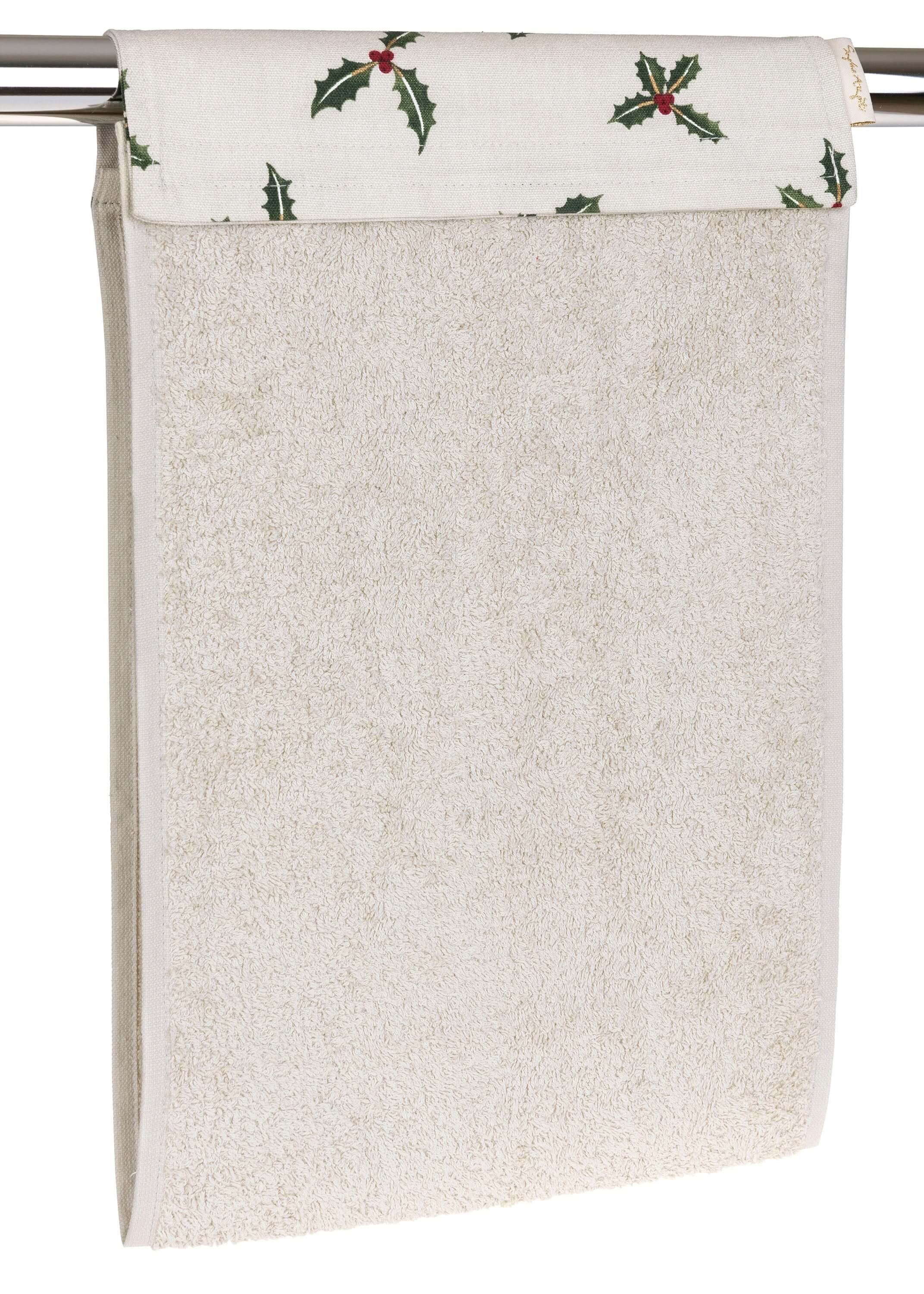 Sophie Allport "Christmas Holly & Berry" Roller Hand Towel hanging over a rail, featuring a soft stone color and festive design.
